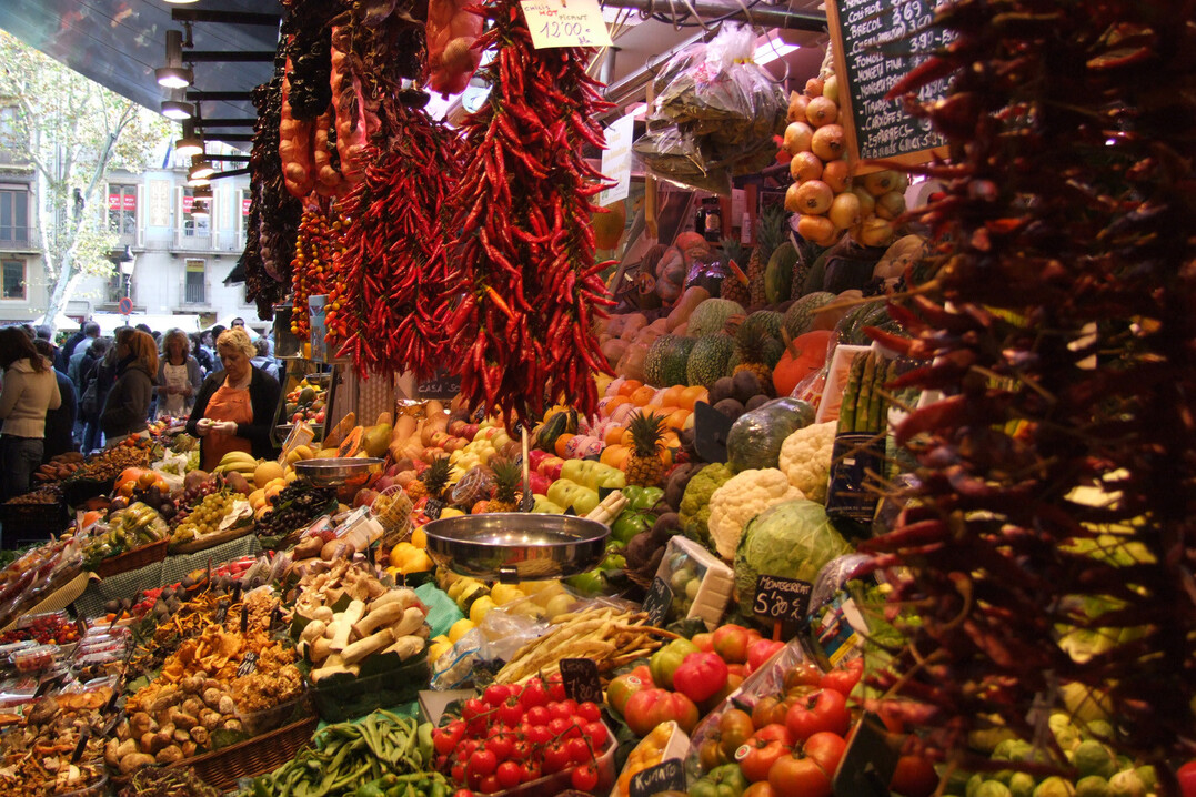 A market stall with fresh fruit, vegetables and spices in Barcelona, Spain
